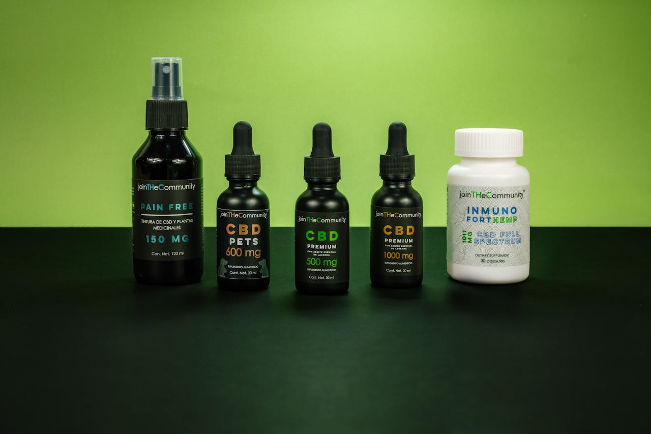 A selection of CBD health products set against a vivid green backdrop representing natural wellness.